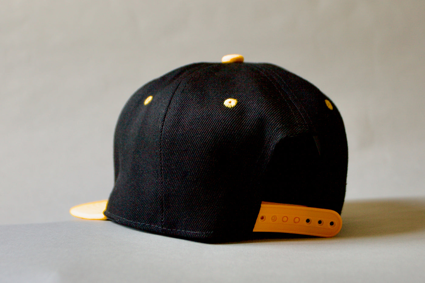 Black and yellow Fo€u$D Cap